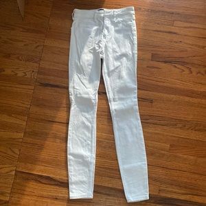 White Hollister high- rise jean legging with advanced stretch. W - 23. L - 28